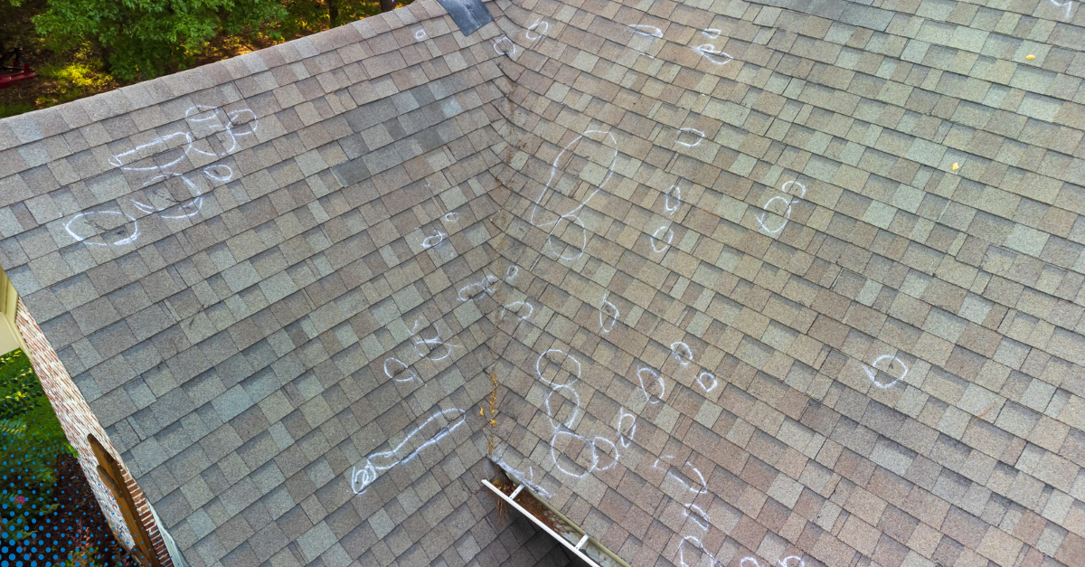 Hail damage on roof marked with chalk.